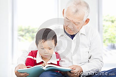 Grandfather telling story to his grandson Stock Photo