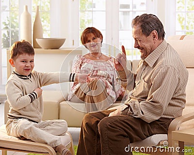 Grandfather telling telling a story to grandson Stock Photo