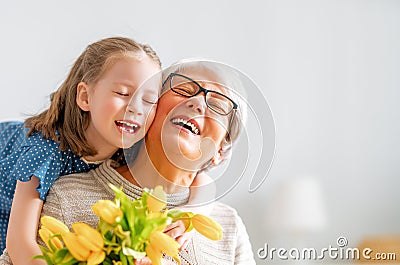 Grandma and girl smiling and hugging Stock Photo