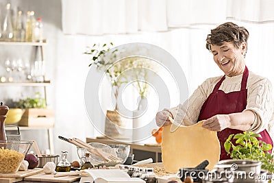 Grandma making a dough Stock Photo