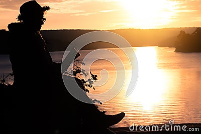 Grandma read a book in nature. Stock Photo