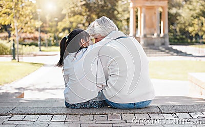 A grandmas heart is a patchwork of love. Rearview shot of a little girl bonding with her grandmother outdoors. Stock Photo