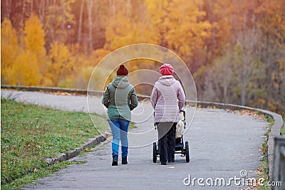 Grandmother and daughter walking in autumn park Editorial Stock Photo