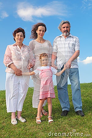 Grandmother, grandfather, mother and little girl Stock Photo