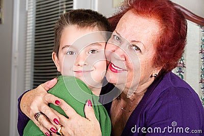 Grandmother and Grandson Cheek to Cheek Hug Stock Photo