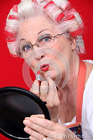 Grandmother with hair in rollers Stock Photo