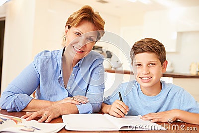 Grandmother Helping Grandson With Homework Stock Photo