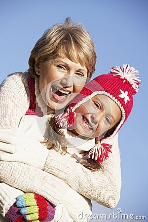 Grandmother Hugging Her Granddaughter Stock Photo