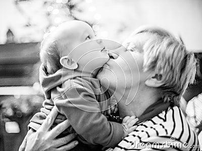 Grandmother kiss her grandson, love moment Stock Photo