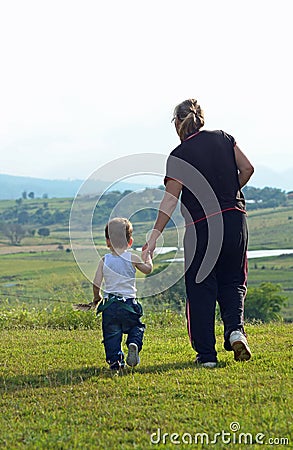 Grandmother taking grandson walk in stunning rural countryside Stock Photo