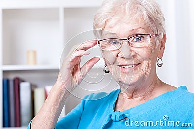 Grandmother wearing reading glasses Stock Photo