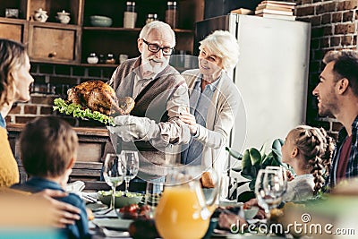 grandpa with delicious turkey for thanksgiving dinner Stock Photo