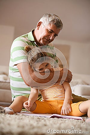 Grandpa with his granddaughter. Playing. Stock Photo