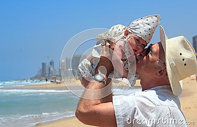 Grandpa is holding a little granddaughter Stock Photo