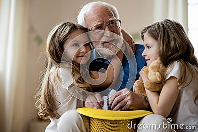 Grandpa playing with kids and looking inspired stock photo Stock Photo