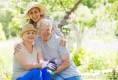 Grandparents with adult granddaughter Stock Photo