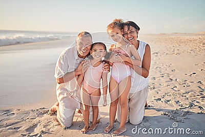 Grandparents with children, happy on beach on holiday and enjoying retirement. Grandpa, grandma and kids enjoy afternoon Stock Photo