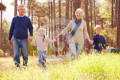 Grandparents and grandchildren walking in the countryside Stock Photo