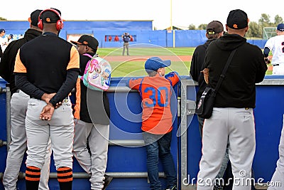 Grandson in orange watching the game Czech-Spain Editorial Stock Photo