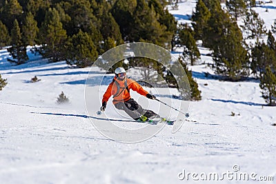 Skier in mountains, prepared piste and sunny day in Grandvalira, Andorra...I Editorial Stock Photo