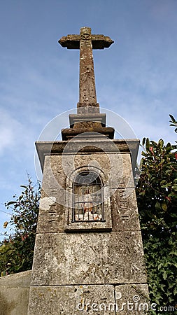 Granite calvary hidden in old french land Stock Photo