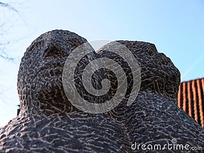 Granite human heads sculpture. Stock Photo