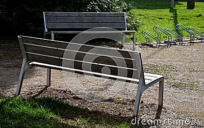 Granite natural paving of irregular shape, brown gray paving in the pedestrian zone in park near the bridge with stairs. garden pa Stock Photo