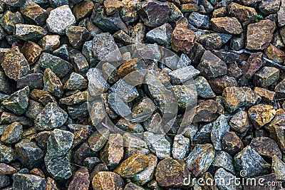 Granite pebble stones ground garden decoration in many different colors and shapes macro closeup background Stock Photo