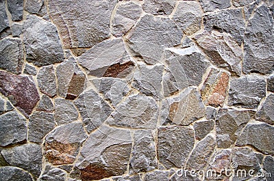 Granite stone walls as background texture Stock Photo