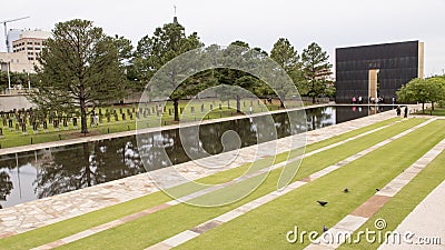 Granite walkway, reflective pool with 9:03AM wall and Field of Empty Chairs, Oklahoma City Memorial Editorial Stock Photo