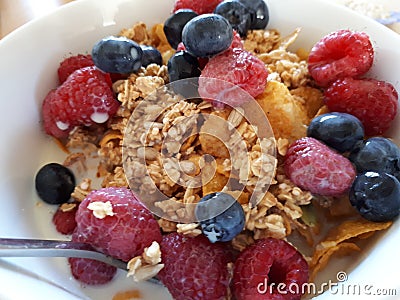 Granola bowl with raspberries and blueberries Stock Photo