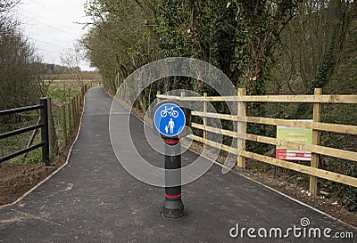 Grantham Canal new entrance asphalt floor and round blue sign for pedestrians and cyclists Editorial Stock Photo