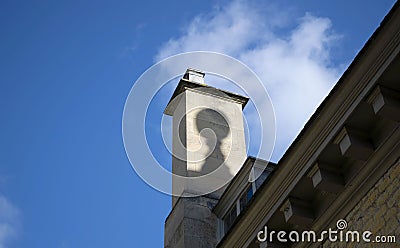 Grantham,Linconshire,England. 6 March 2020. Building with shadow detail in the chimney and blue sky background. Editorial Stock Photo