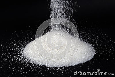 Granulated sugar on a black background Stock Photo