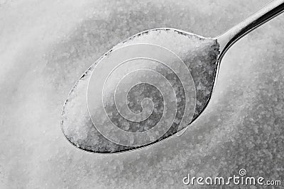 Granulated sugar on a spoon Stock Photo