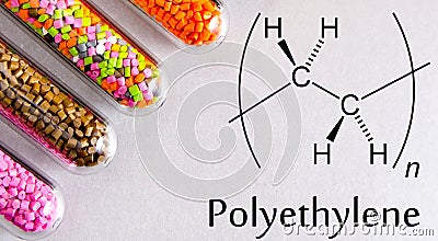 Granules of the POLYETHYLENE, chemical formula. Plastic pellets and scheme of the chemical structure .Colored Plastic Granules Stock Photo
