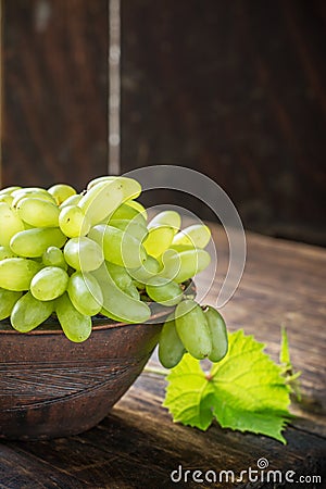 Grape varieties of ladies' fingers in a brown Stock Photo