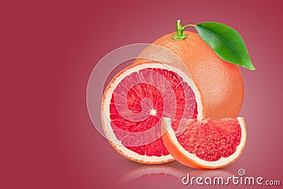 Grapefruit with leaf on red background. With clipping path. Full depth of field. Stock Photo