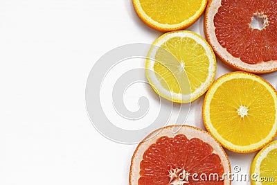 Grapefruit and lemon slices on white background. Tropical bright juicy fruit vegetarian healthy diet flat lay banner Stock Photo