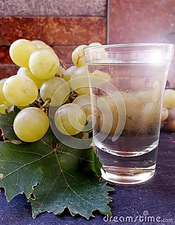 Grapes and glass of dry wine Stock Photo