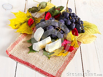 Grapes , leafs and cheese Stock Photo