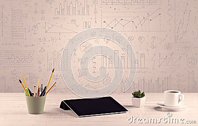 Graph charts and designer office desk Stock Photo