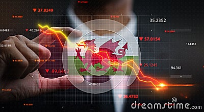 Graph Falling Down in Front Of Wales Flag. Crisis Concept Stock Photo