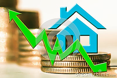 The graph of growth and a symbol of real estate on a background of money . Stock Photo