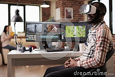 Graphic artist using vr glasses to edit video Stock Photo