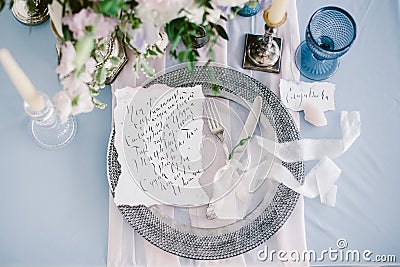 Graphic arts of beautiful wedding calligraphy cards and silver plate with cutlery. Stock Photo