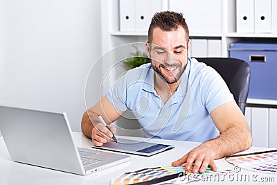 Graphic designer using a graphics tablet in a modern office Stock Photo