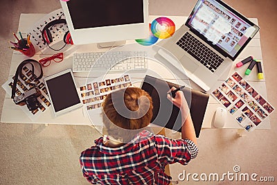 Graphic designer working at desk Stock Photo