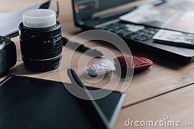 Graphic designer workstation with dslr, lens, laptop, agenda, stylus and 3d objects Stock Photo