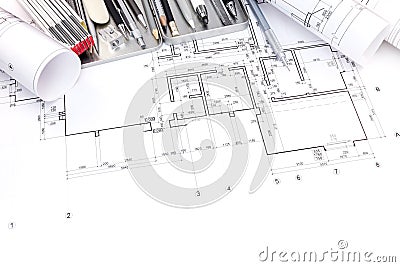graphical plan of apartment rooms and blueprint rolls with drawing tools Stock Photo